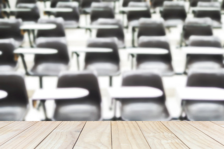 Wooden plank floor over blurred of empty lecture roomの写真素材