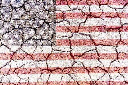 USA flag overlay on dry cracked ground texture for background useの写真素材