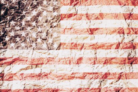 USA flag overlay on brown tone crumpled paper abstract backgroundの写真素材