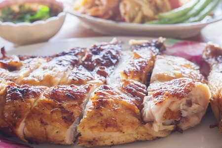 Thai style spicy meal, chicken grilled with spicy papaya saladの写真素材