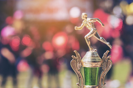 Sport trophy over blur crowded people in school sport day festivalの写真素材