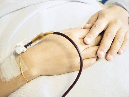 Lady getting treated in hospitalの写真素材