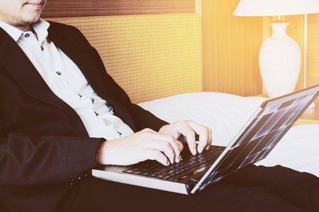 Business man working in hotel roomBusiness man working in hotel roomの写真素材