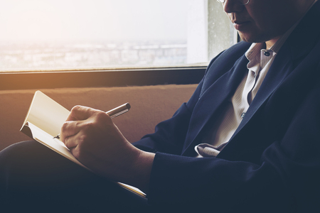 Business man working in hotel roomの写真素材