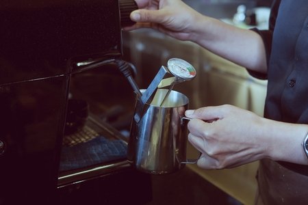 Vintage photo of barista is making coffee in coffee shopの写真素材