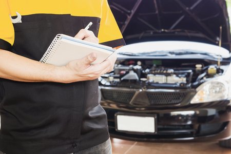 Mechanic man repairing carの写真素材