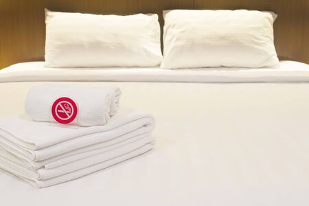 White bedding and towel set in modern hotelの写真素材