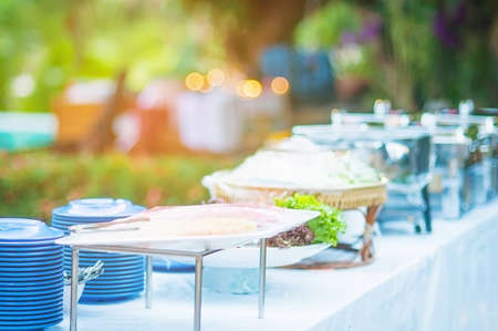 Food preparation table ready to be served - outdoor garden party self service buffet conceptの写真素材