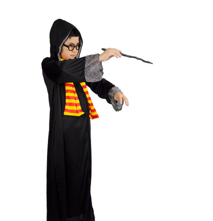 Kid playing as a wizard on halloween dayの写真素材