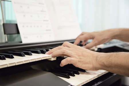 Man hand play electone keyboard - people with music conceptの写真素材