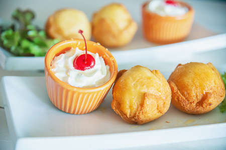 Colourful fried ice cream ball dish - fast delicious unhealthy food concept