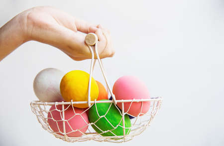 Child showing colorful Easter eggs happily - Easter holiday celebration conceptの写真素材
