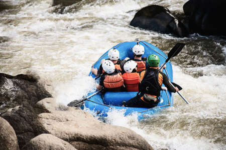 People playing raft adventure sport activity in the river