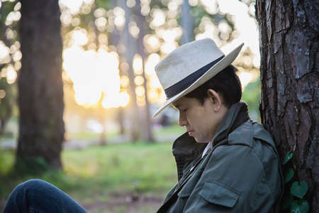 People portrait in green forest nature with warm sun light