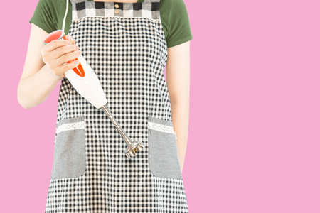 Happy lady holding kichen stuff over copy space background - people home made food preparation conceptの写真素材