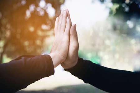 Man touching / holding hand together for success commitment work concept