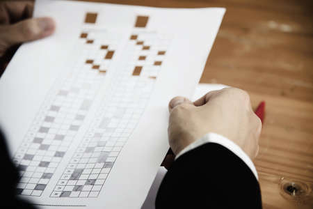 Instructor checking multiple choices answer sheet exam - education people working with paper test conceptの写真素材