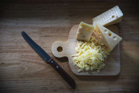 Beautiful cheeses in the kitchen - cheese food preparing conceptの写真素材
