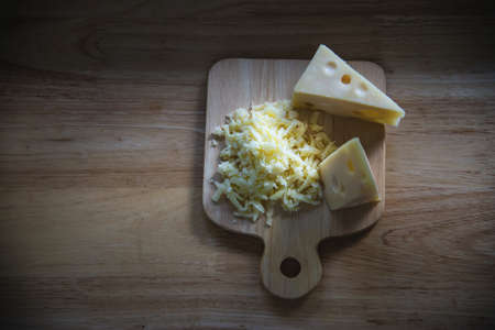 Beautiful cheeses in the kitchen - cheese food preparing conceptの写真素材