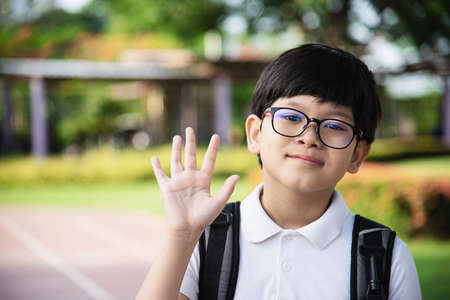 Young Asian Thailand boy happy going to school - children back to school concept.の写真素材