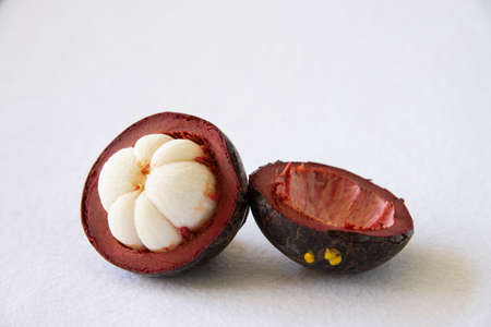 Mangosteen Thai popular fruits - a tropical fruit with sweet juicy white segments of flesh inside a thick reddish-brown rind.の写真素材