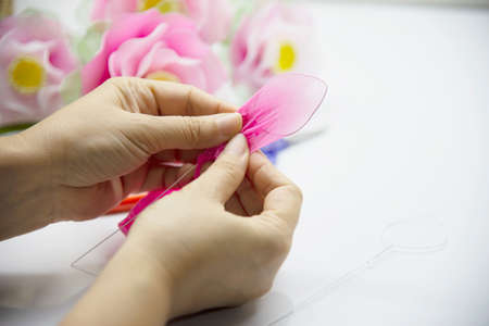 Woman making beautiful nylon flower - people with DIY handmade flower conceptの写真素材