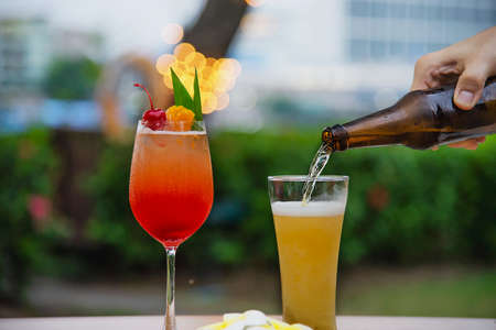People celebration in restaurant with beer and mai tai or mai thai - happy lifestyle people with...