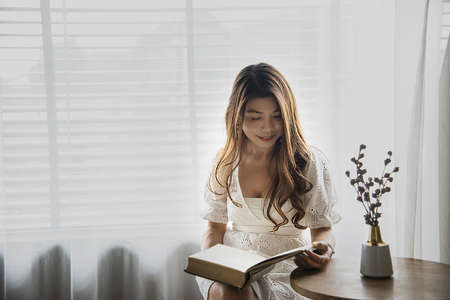 Lovely Asian lady portriat in coffee shop - happy woman lifestyle conceptの写真素材