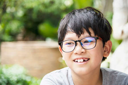 Young Thai boy smiling portrait - happy Asian boy conceptの写真素材
