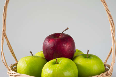 Fresh colorful apple over gray background - clean fresh fruit background conceptの写真素材