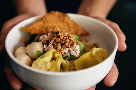 Closeup of man serve noodle recipe - favorite food for Asian people concept