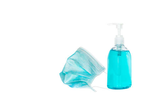 Mask and alcohol gel isolated over white background for Covid-19 protection - medical health protection during Covid-19 spreading object conceptの写真素材