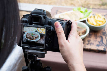 People using digital camera taking food photograph or video product