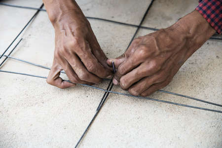 Construction worker are tying up the structural steel, floor concrete pouring preparation