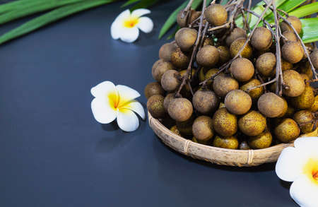 Thai longan fruit over blue copyspace backgroundの写真素材