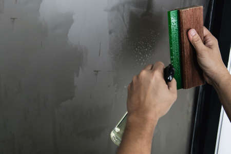 People installing sticker film to mirror window house interior decoration