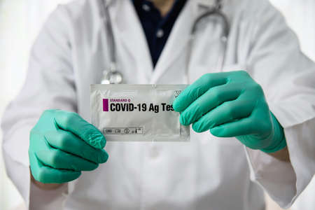 Doctor show rapid antigen test Covid -19 self repid test set