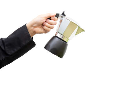 Barista's hand holding moka pot over white backgroundの写真素材