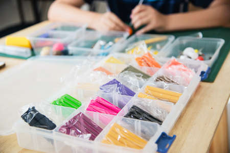 Boy is playing polymer clayの写真素材