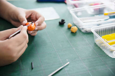 Boy is playing polymer clayの写真素材