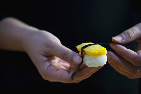 japanese maki sushi roll serving in oriental restaurant, chef is preparing japan tradition cookery menu, various different assorted luxury mixed healthy eating set conceptの写真素材