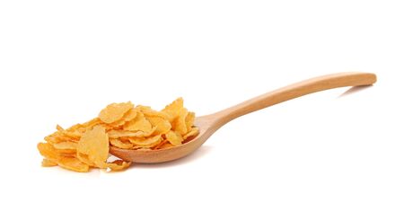 corn flakes in spoon isolated on white background