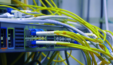 optic fiber cables connected to data centerの写真素材