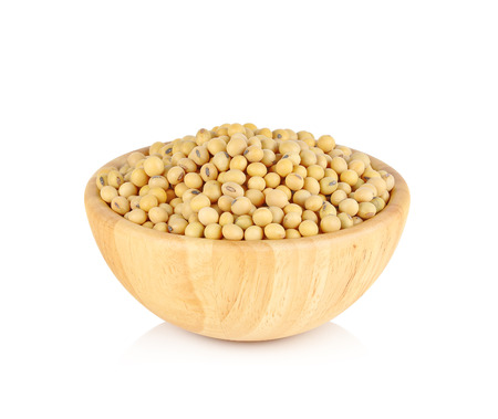 soy beans in wooden bowl on white backgroundの写真素材