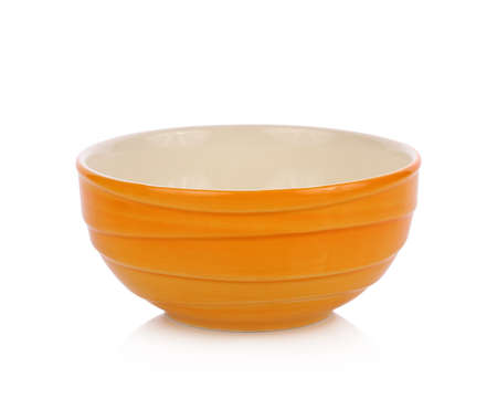Empty orange ceramic bowl isolated white backgroundの写真素材