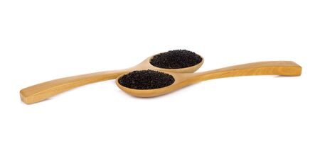 Basil seeds in spoon on white backgroundの写真素材