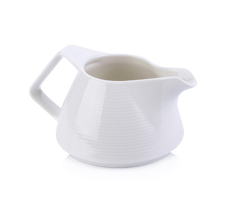 White ceramic milk jar on white backgroundの写真素材