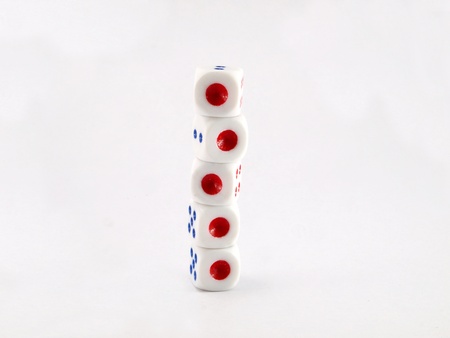Dice arranged vertically to show the world a new perspective
