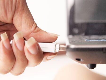 Plug the thumb driveの写真素材
