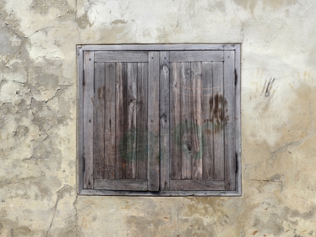 wood window on old wall backgroundの写真素材